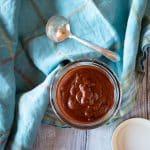 A jar of homemade red enchilada sauce.