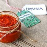 A jar of harissa paste wrapped for a holiday gift.
