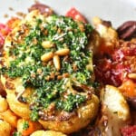Cauliflower Steaks topped with pesto and breadcrumbs, served over a citrus salad.