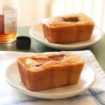 Mini cornbread loaves with strawberries and maple syrup.