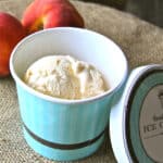 A carton of freshly made non-fat peach frozen yogurt with honey.