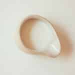 A small pitcher of evaporated milk.