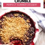 Strawberry Blueberry Crumble in a pie plate with a serving spoon.