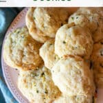 A plate of lemony zucchini cookies on a tea towel with text overlay.