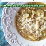 A bowl of summer vegetable farro soup with text overlay.